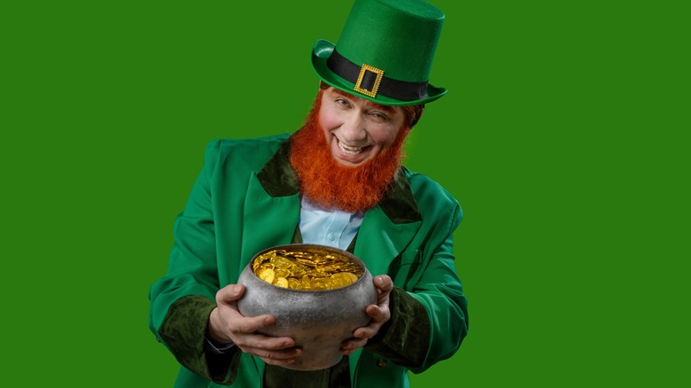 Leprechaun holding pot of gold