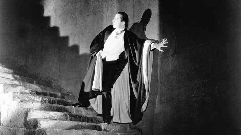 Dracula on staircase in lightbeam