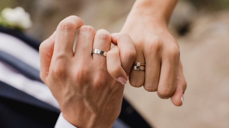 man and woman holding hands