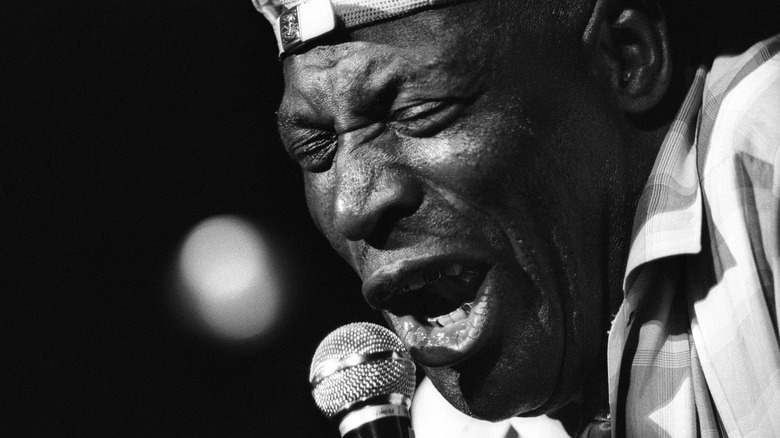 Howlin' Wolf singing into microphone