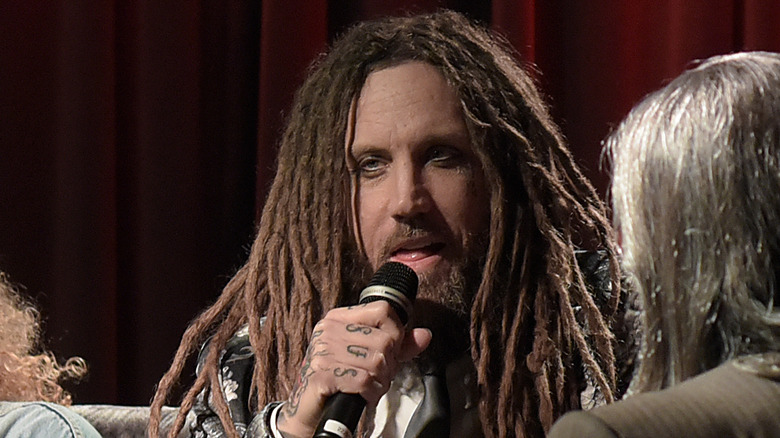 Welch with a microphone