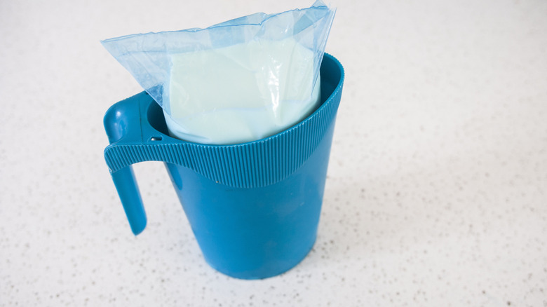 One litre milk bag in pitcher