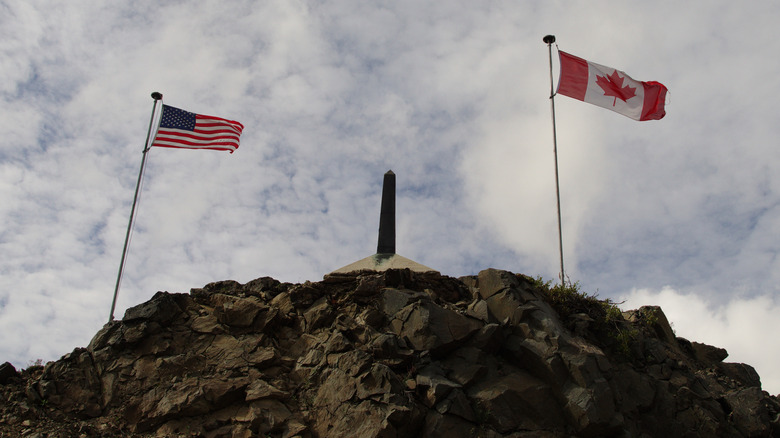 U.S. and Canadian flags at Alaskan border