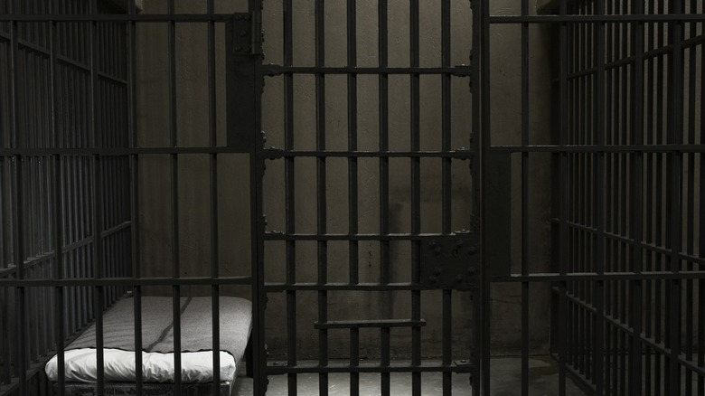 prison cell with bed