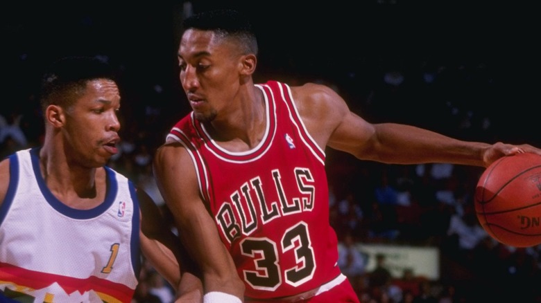 Scottie Pippen drives against Mark Macon
