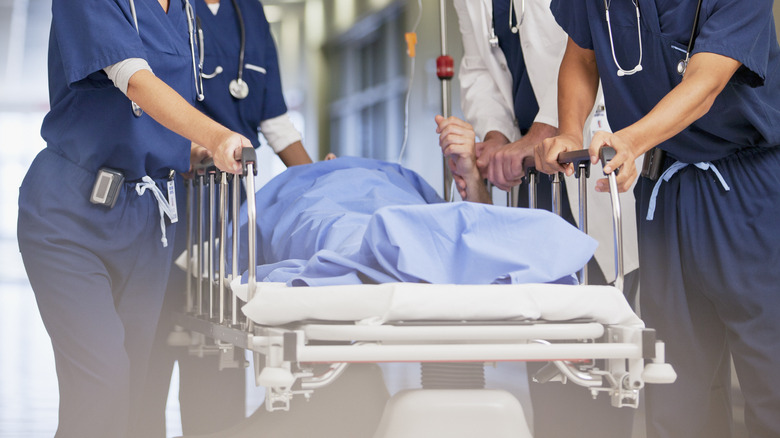 Person wheeled through ER