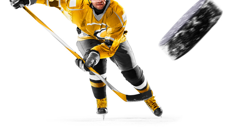 Hockey player chasing puck