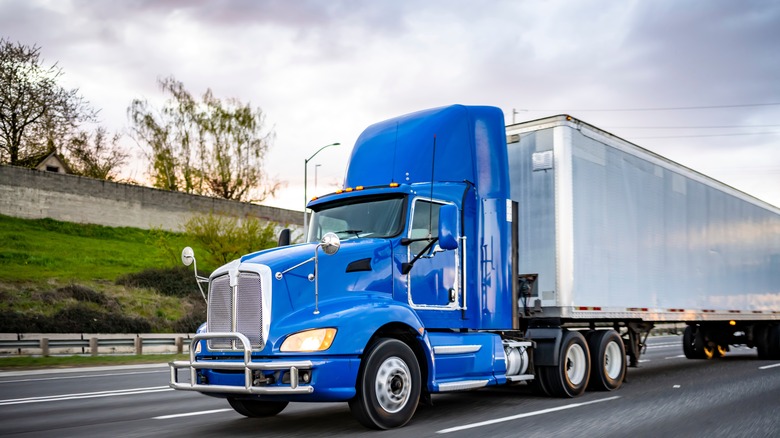 A semi-truck transporting cargo on the interstate