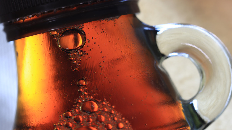 Close-up of the tiny handle on a maple syrup bottle