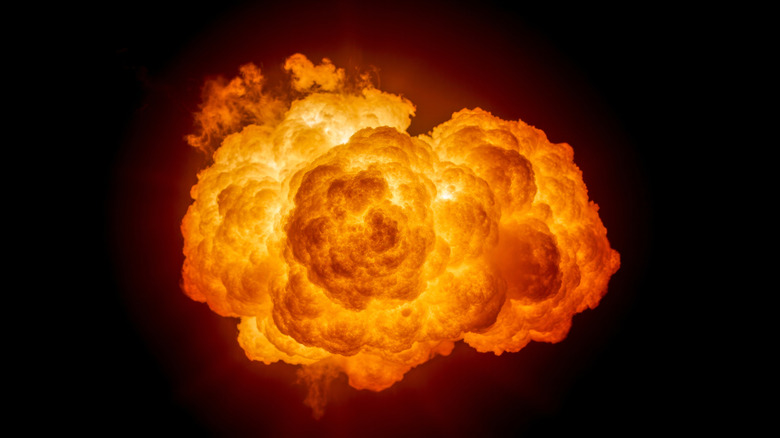 fiery explosion in black sky