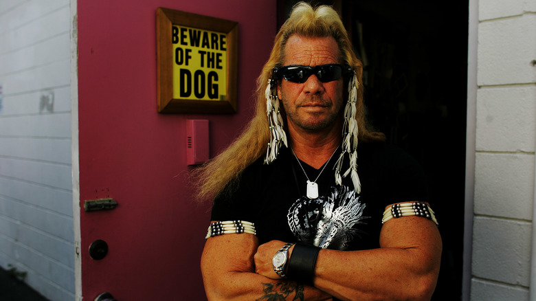 Dog bounty hunter arms crossed