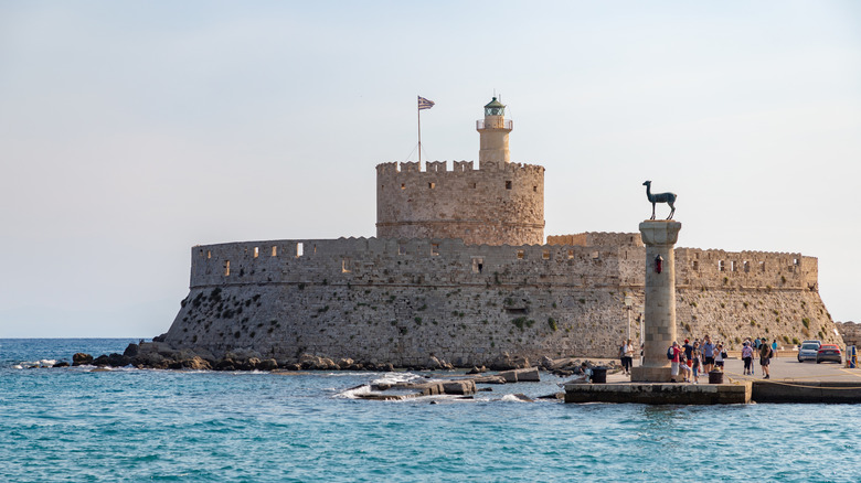 Castle of Rhodes and Doe statue in daylight