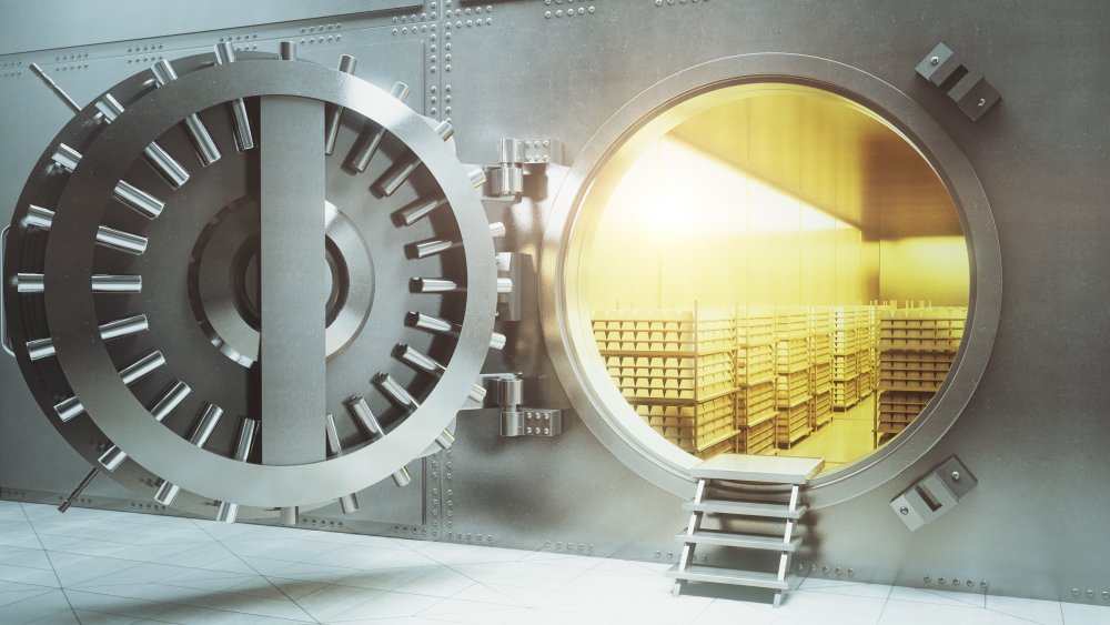 Bank vault holding stacks of gold