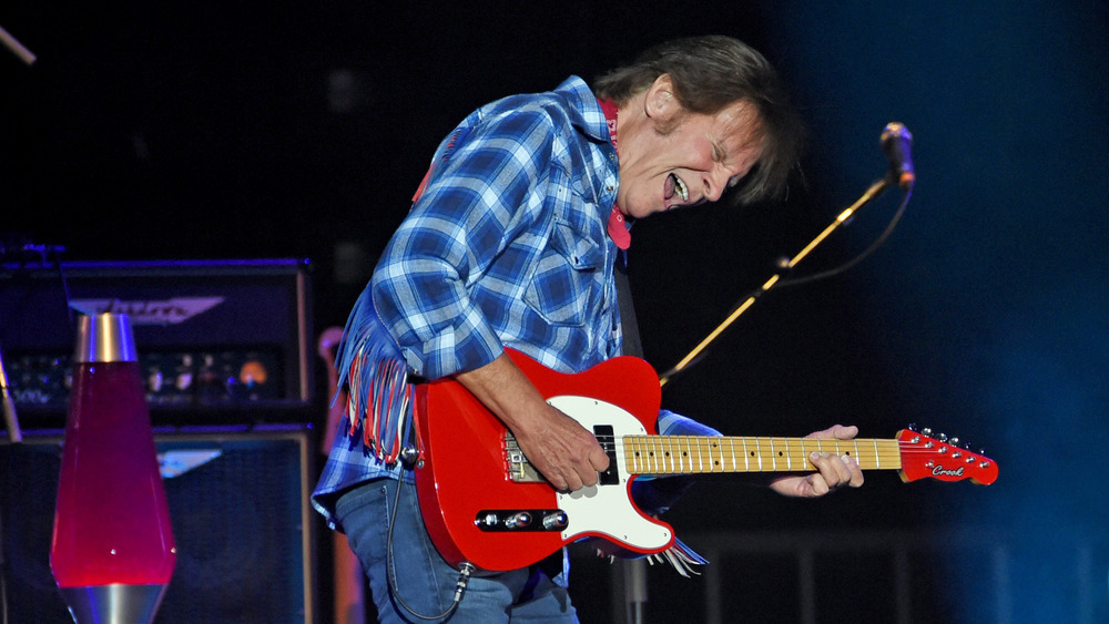 John Fogerty performing onstage in 2019