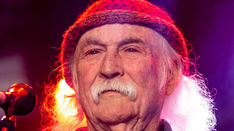 David Crosby standing onstage