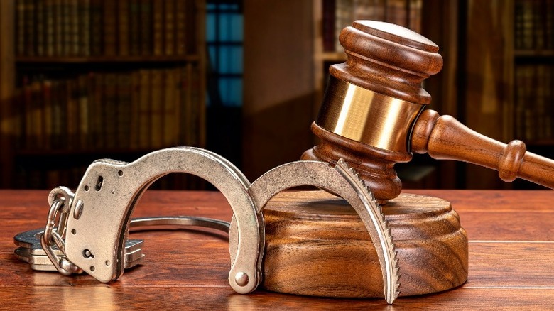 judge's gavel and handcuffs