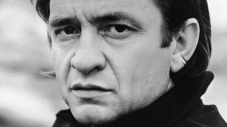 singer Johnny Cash looking stern