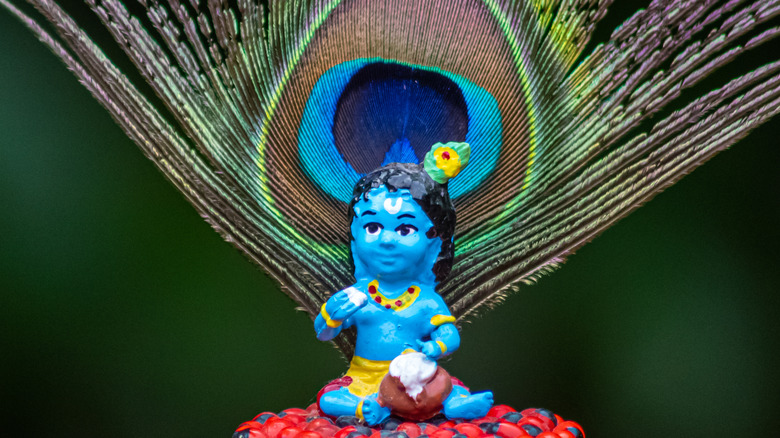  Sri Krishna statue with peacock feather