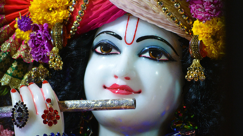 Face closeup on Krishna deity statue