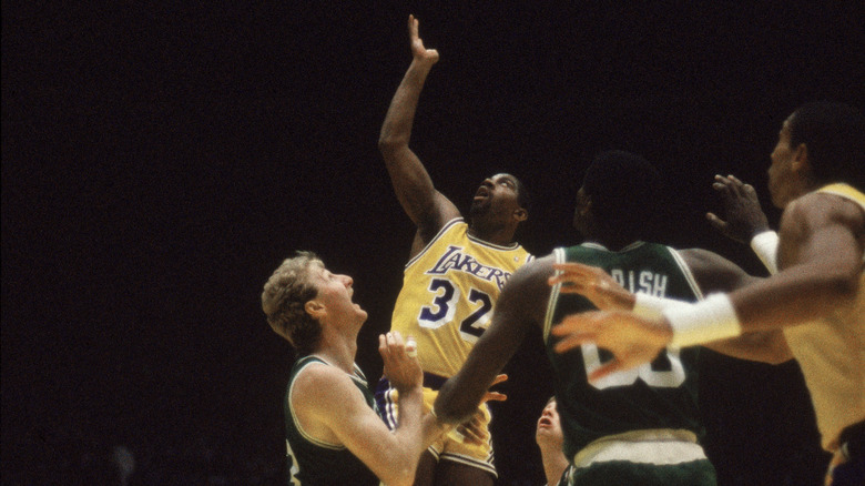 Larry Bird watching Magic Johnson score 
