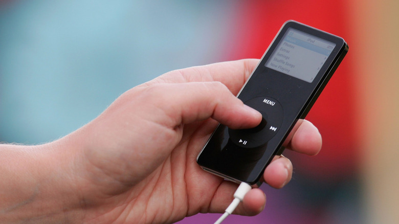 Hand holding black iPod