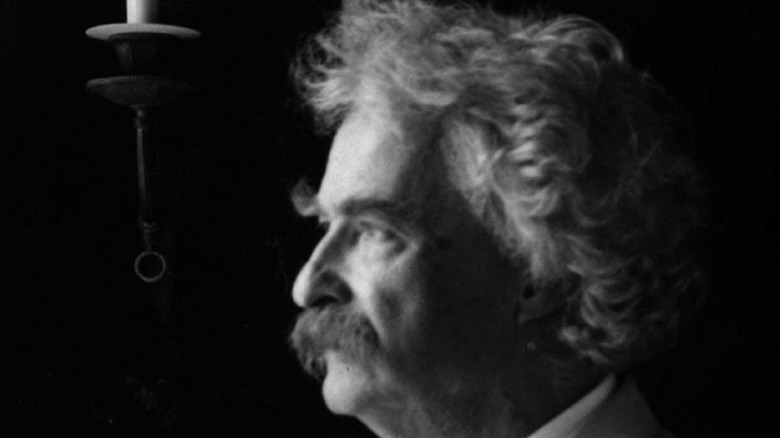 Mark Twain looking out window