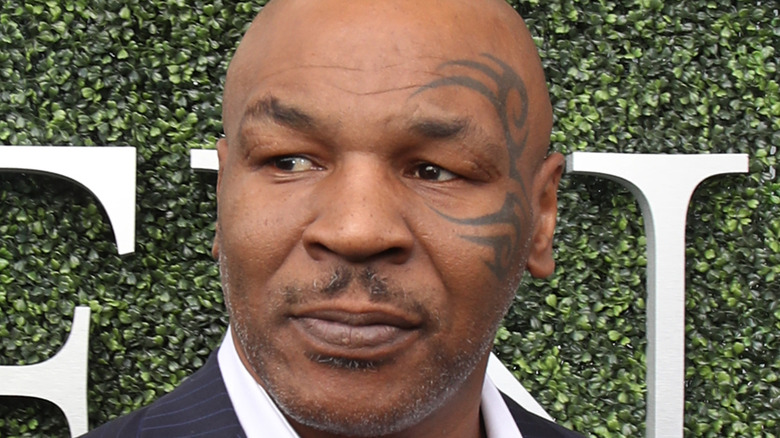 Mike Tyson posing for photos