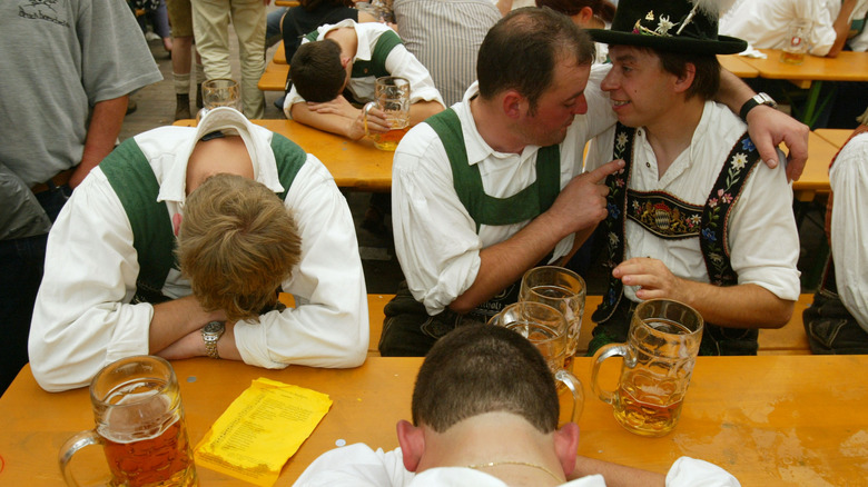 Drunk men in Oktoberfest beer tent
