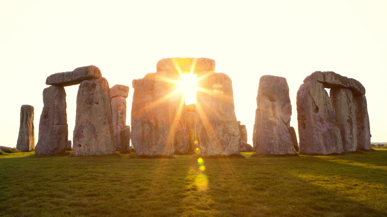 Winter solstice sunrise cutting through Stonehenge