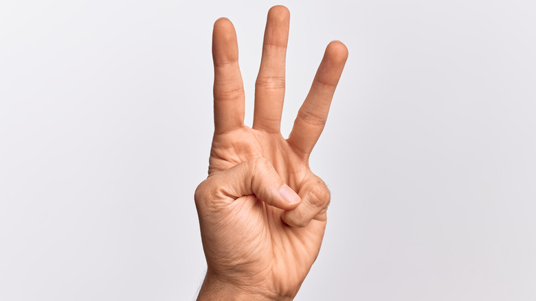 Three fingers raised