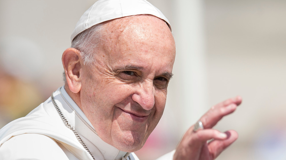 Pope Francis greets a crowd