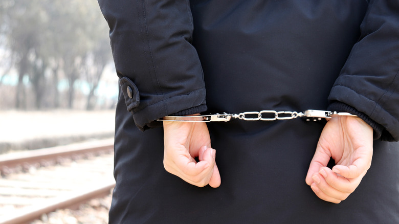 person jacket wearing handcuffs 