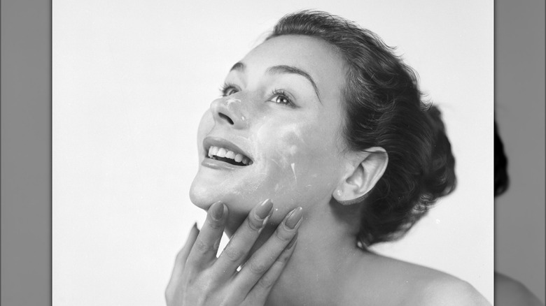 woman applying face cream