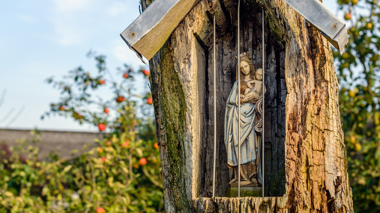 Virgin Mary statue behind bars