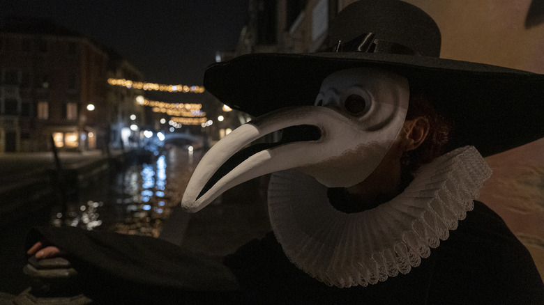 Person dressed as plague doctor