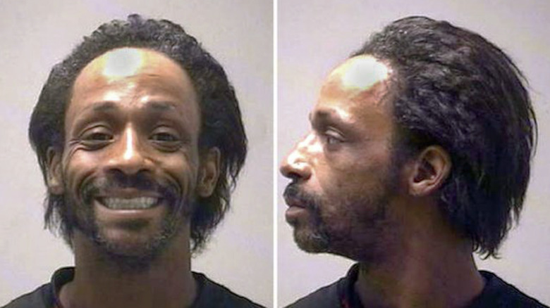 Katt Williams smiling in mug shot
