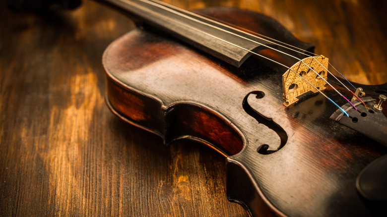 violin on wooden surface