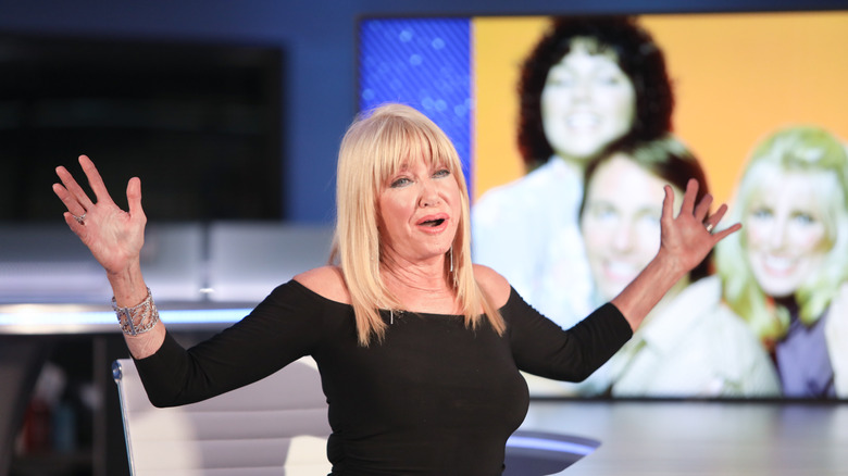 Suzanne Somers in front of a Three's Company poster, 2020