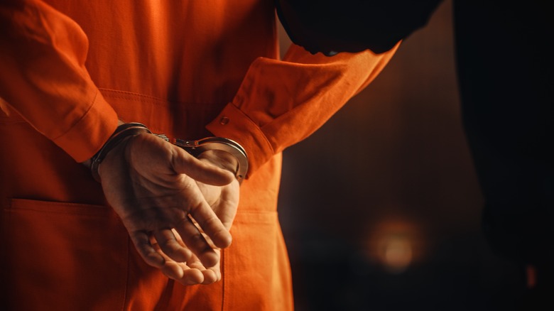 Prisoner in orange jumpsuit