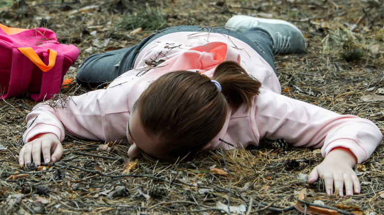 child passed out on ground