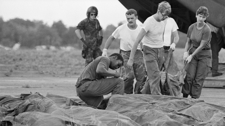 US military personel remove bodybags