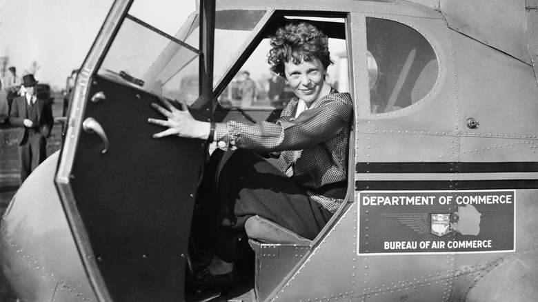Amelia Earhart opening cockpit door