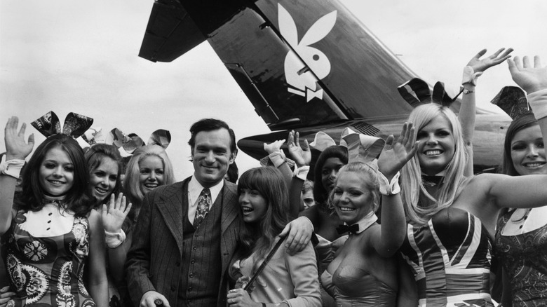 Hugh Hefner surrounded by Playboy bunnies 