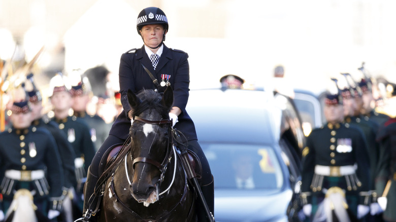 officer riding in Queen Elizabeth II's procession