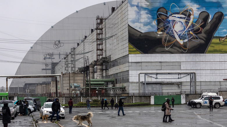 Journalists stand outside the Chernobyl power plant in 2022