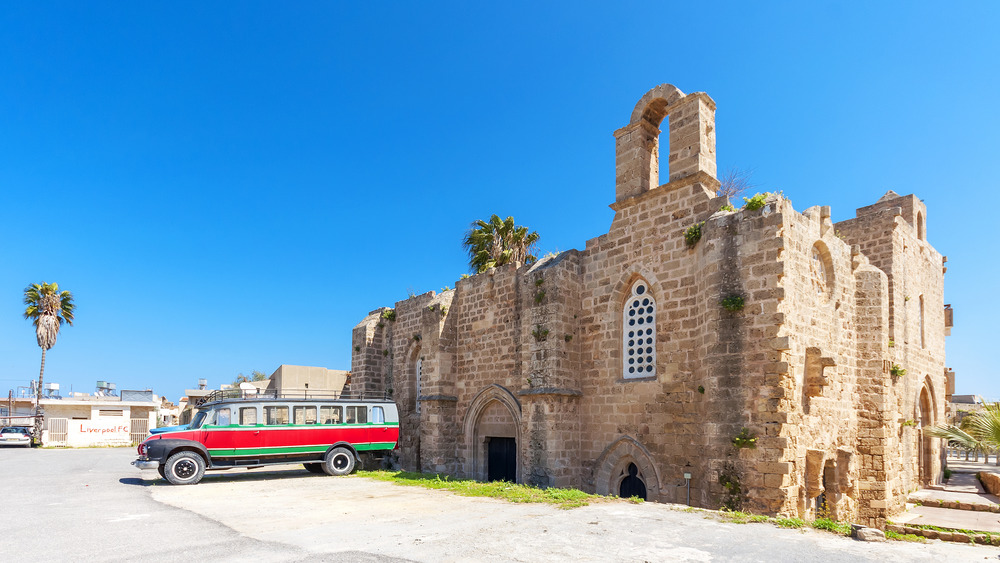 twin churches of templars and hospitalliers with bus in front
