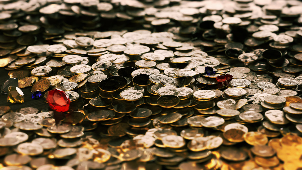 a pile of gold coins and jewels