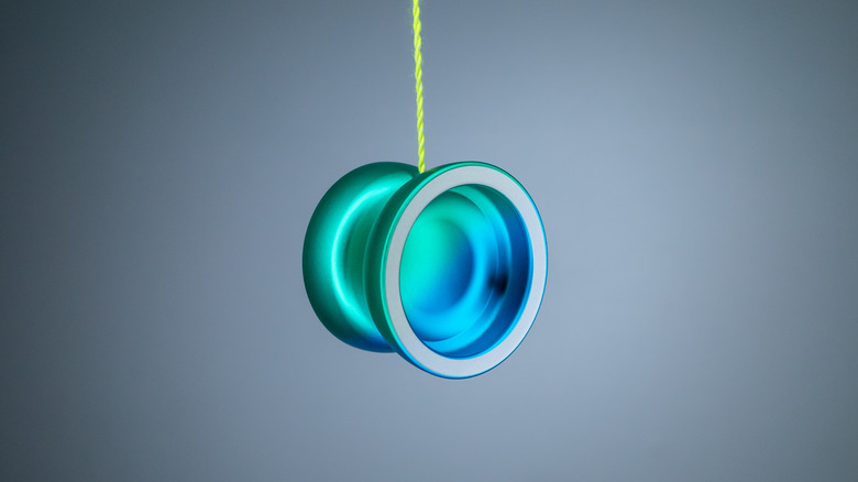 A yo-yo on the end of its string