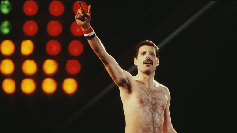 Freddie Mercury without a shirt, performing onstage