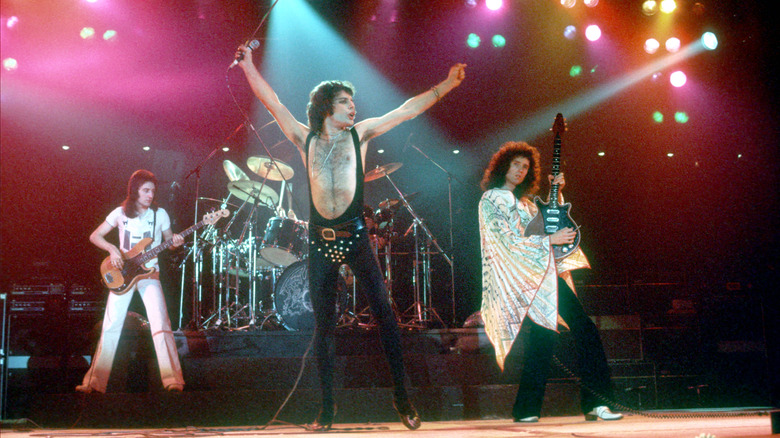 Queen performing onstage in 1977